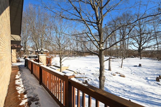 view of snow covered deck