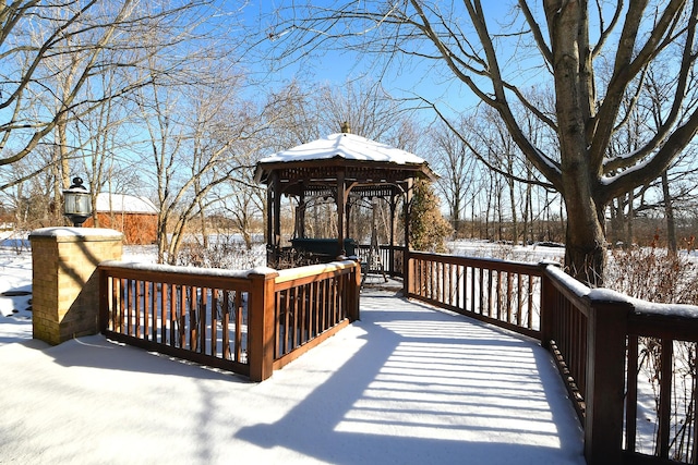 snow covered deck with a gazebo