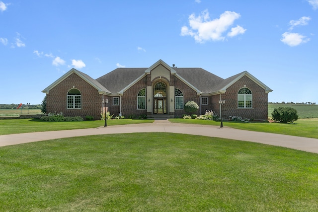 single story home with a front yard