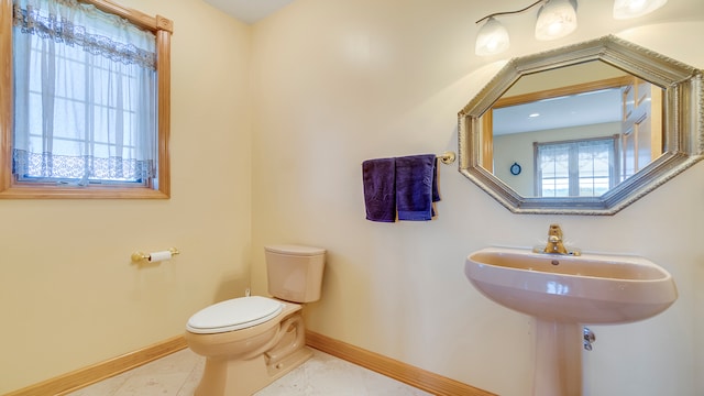 bathroom featuring tile patterned floors and toilet