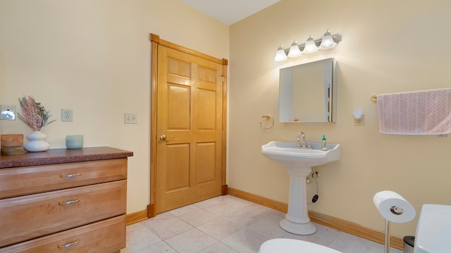 bathroom with tile patterned flooring