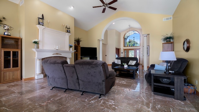 living room with ceiling fan and high vaulted ceiling