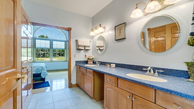 bathroom with tile patterned flooring and vanity