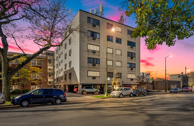 view of outdoor building at dusk