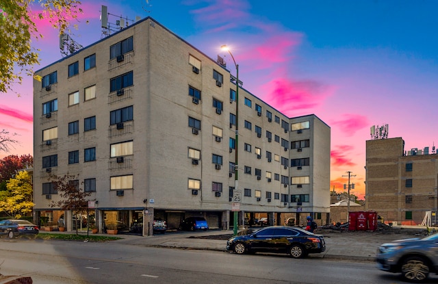 view of outdoor building at dusk