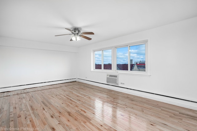 empty room featuring ceiling fan, light hardwood / wood-style floors, an AC wall unit, and a baseboard radiator