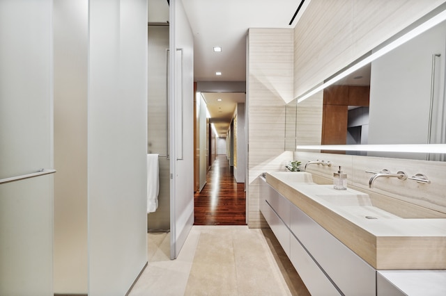 bathroom featuring tile patterned flooring and vanity