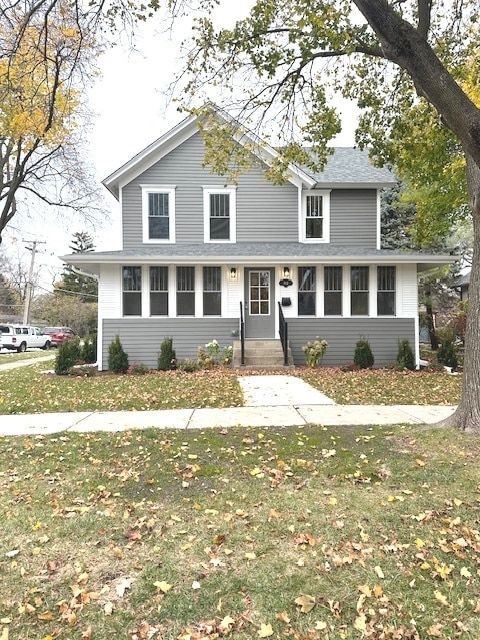 view of property with a front lawn