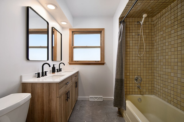 full bathroom with vanity, toilet, shower / bathtub combination with curtain, and a healthy amount of sunlight