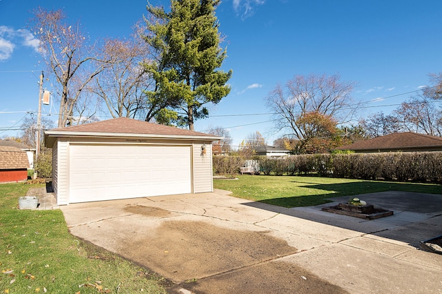 garage featuring a yard