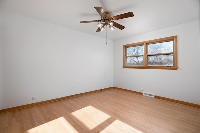 empty room with light wood-type flooring and ceiling fan