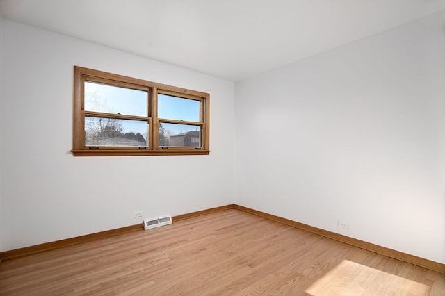 empty room with light wood-type flooring