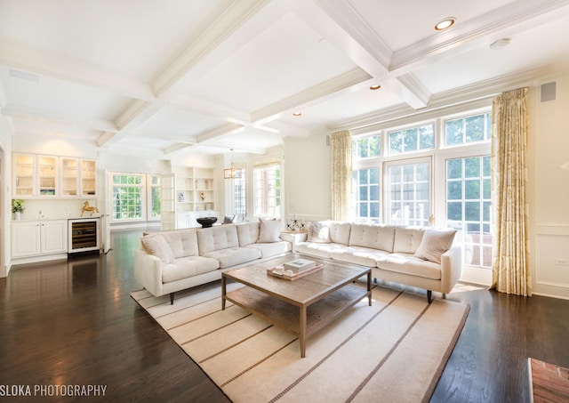 living room with dark wood-type flooring, coffered ceiling, a wealth of natural light, beam ceiling, and beverage cooler