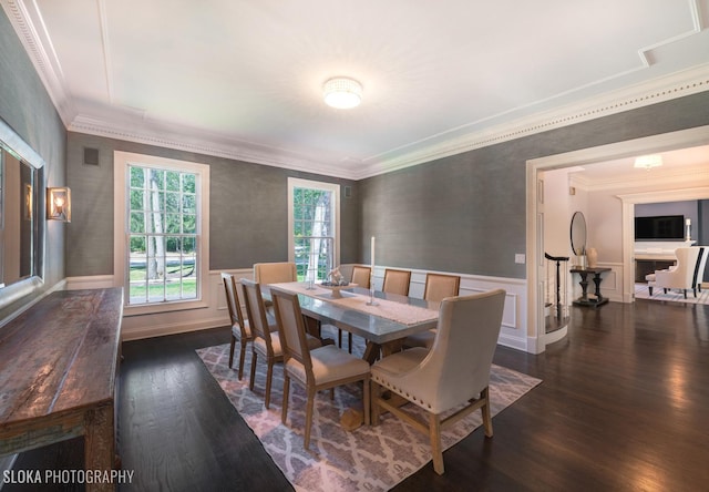 dining room featuring dark hardwood / wood-style flooring and ornamental molding