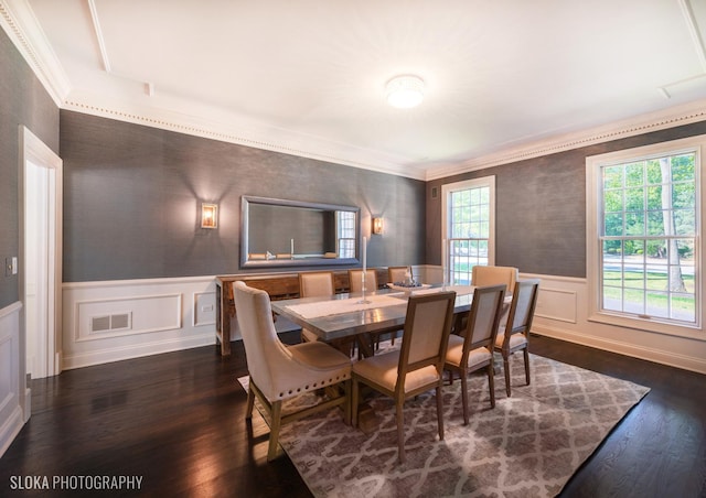 dining area with crown molding, dark hardwood / wood-style flooring, and a healthy amount of sunlight