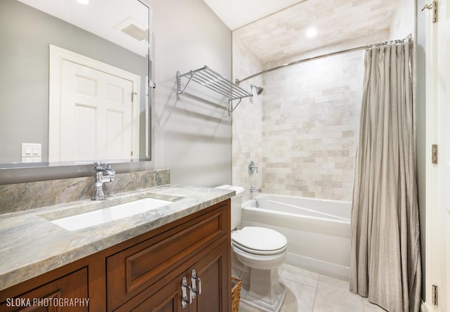 full bathroom featuring tile patterned floors, shower / bath combo with shower curtain, vanity, and toilet