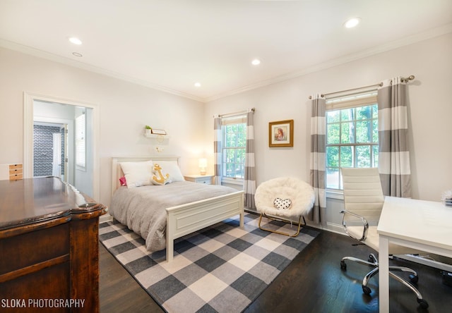 bedroom with dark hardwood / wood-style floors, multiple windows, and ornamental molding