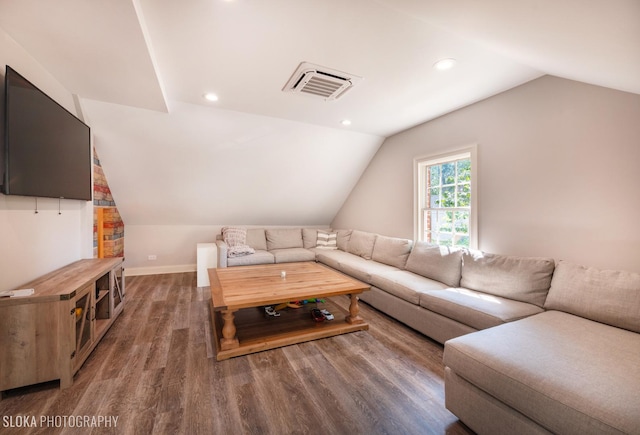 living room featuring dark hardwood / wood-style flooring and lofted ceiling