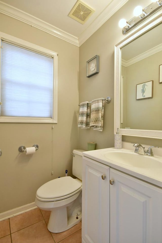 bathroom featuring tile patterned flooring, vanity, crown molding, and toilet