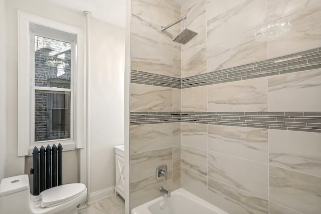 bathroom featuring tiled shower / bath combo, toilet, and radiator