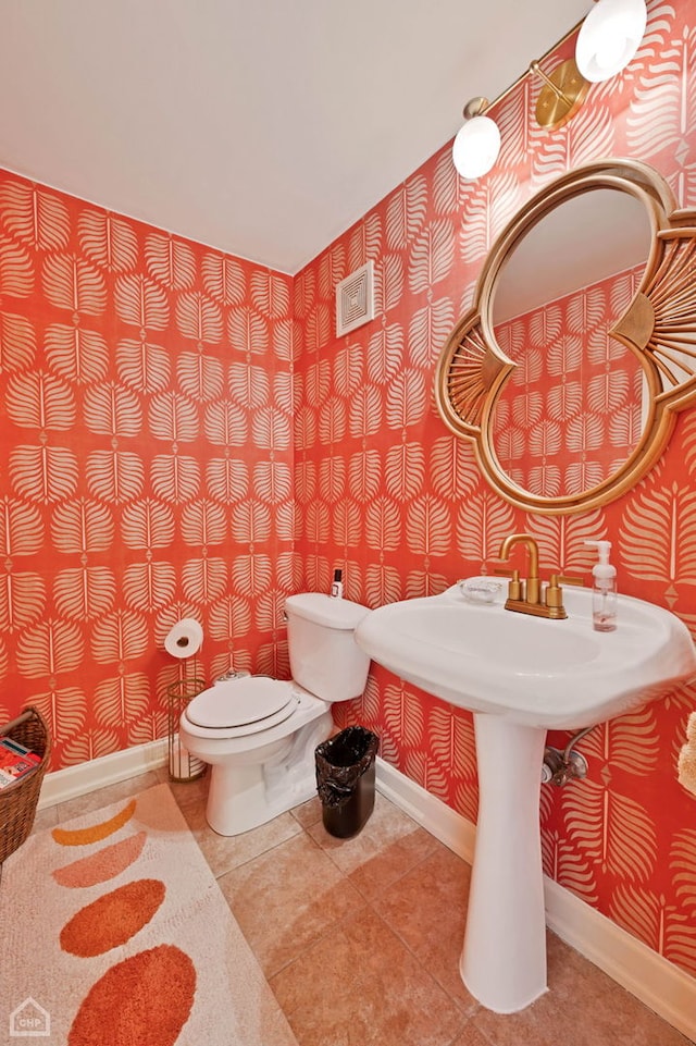 bathroom with tile patterned flooring and toilet