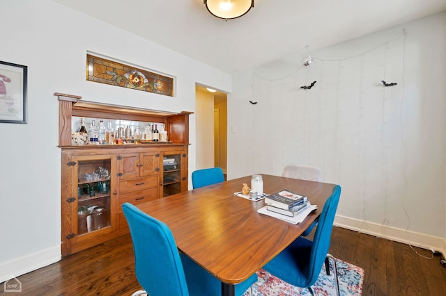 dining room with dark hardwood / wood-style floors