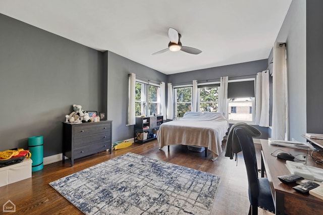 bedroom featuring dark wood-type flooring and ceiling fan