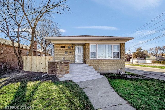 bungalow-style home featuring a front lawn