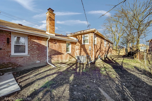 rear view of property featuring cooling unit