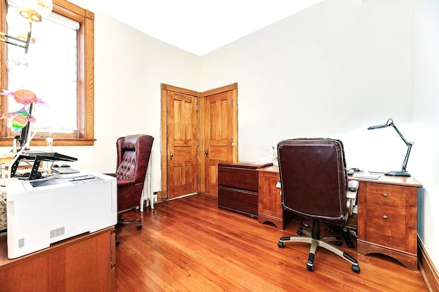 office space with light wood-type flooring