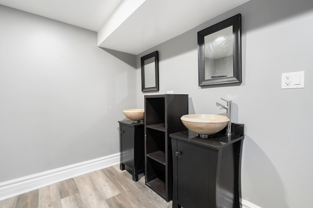 bathroom featuring wood-type flooring and vanity