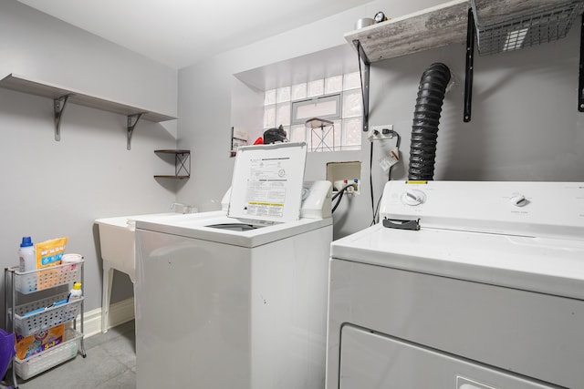 laundry room with washing machine and clothes dryer