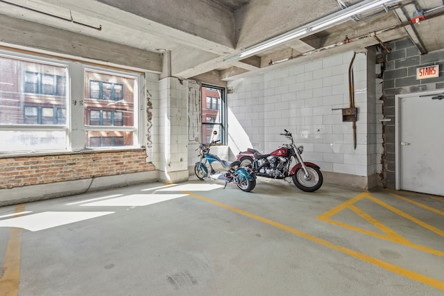 interior space with a healthy amount of sunlight and concrete floors