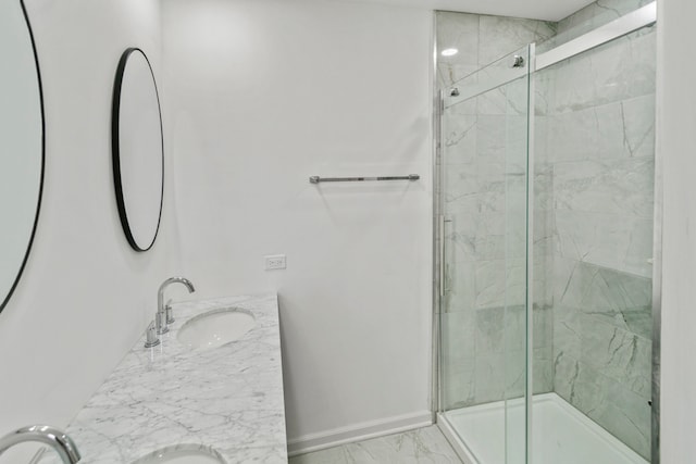 bathroom with vanity and a shower with door