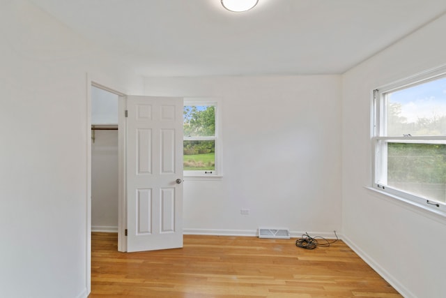 empty room with light hardwood / wood-style floors