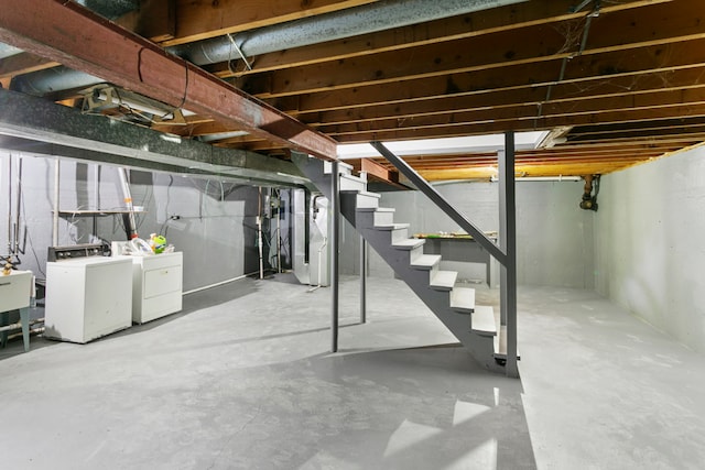 basement featuring washer and clothes dryer