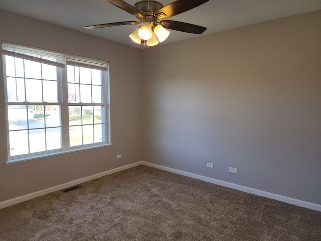 empty room with carpet floors and ceiling fan