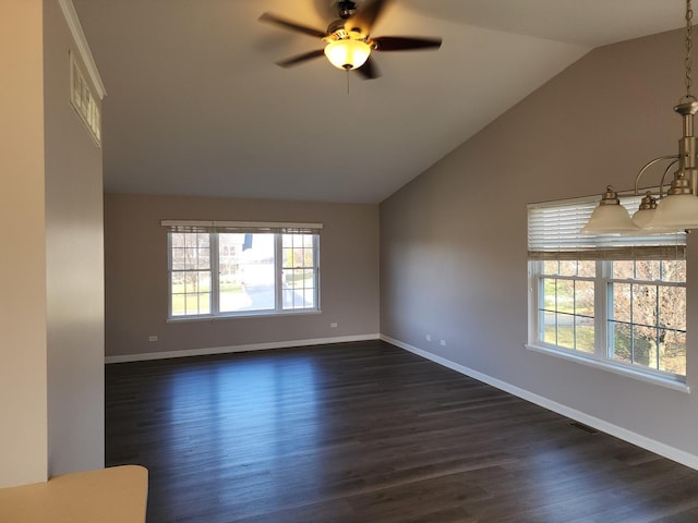 spare room featuring vaulted ceiling, ceiling fan, and dark hardwood / wood-style floors