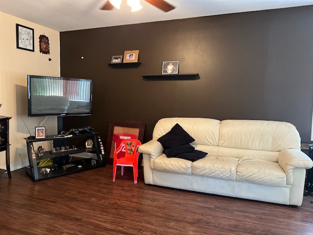 living room with dark hardwood / wood-style floors and ceiling fan