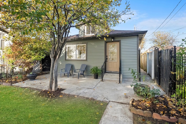 rear view of house with a patio