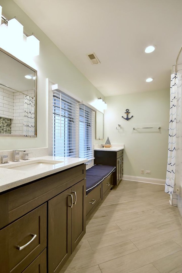 bathroom with vanity and shower / bath combo