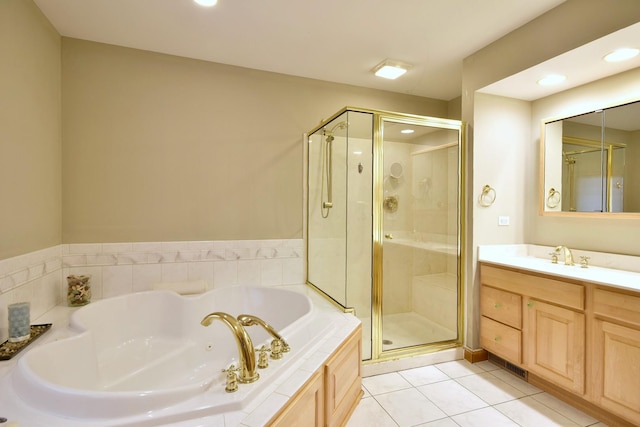 bathroom featuring tile patterned floors, separate shower and tub, and vanity