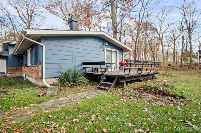 view of side of property featuring a wooden deck