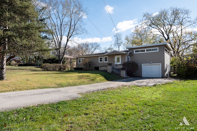 view of front facade with a front yard and a garage