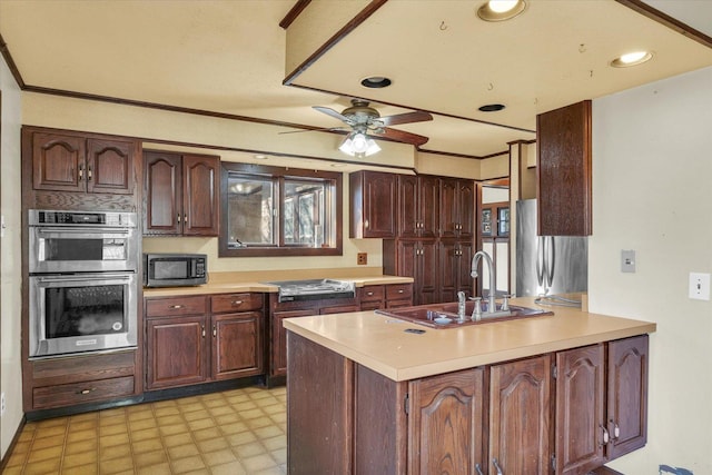 kitchen with sink, crown molding, stainless steel appliances, and ceiling fan