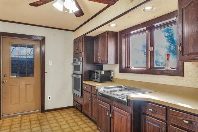 kitchen with ceiling fan, crown molding, stovetop, and stainless steel double oven