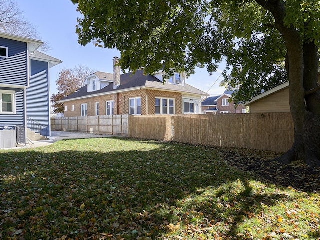 view of yard with central AC unit