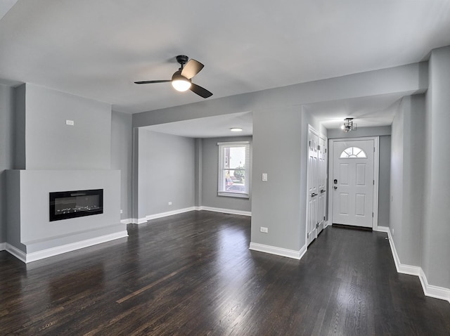 foyer entrance with ceiling fan and dark hardwood / wood-style floors