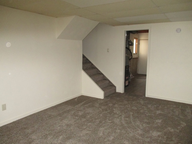 interior space featuring dark colored carpet