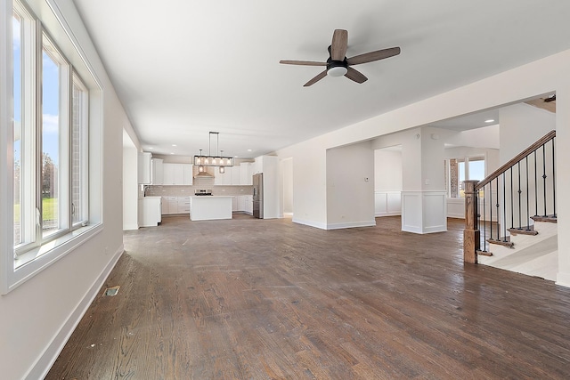 8035 Stanley Trl, Frankfort, IL 60423 - unfurnished living room with dark wood-type flooring, ceiling fan, baseboards, recessed lighting, and stairs